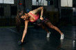 © Branko Starcevic/Stocksy - Athlete woman practicing with dumbbells.