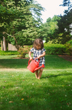 Little Girl With Watering Can