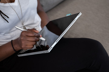 Woman drawing on a device