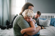 © Bruce and Rebecca Meissner/Stocksy - Mom comforting crying son