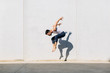 © Marc Bordons/Stocksy - A dancer dancing in front of a concrete wall