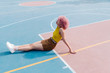 © Lucas Ottone/Stocksy - Cool woman with pink hair