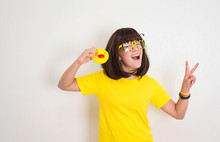 Teen Girl In Funny Glasses With Duck Face And Yellow Rubber Duck Having Fun. Party Props, Photo Booth And People Concept.