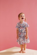 Funny Little Girl Studio Portrait On Pink Background