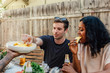 © Jayme Burrows Photography/Stocksy - Man and Woman Eat Pineapple