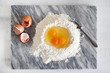 © Silk And Salt Images/Stocksy - Eggs in a flour well for pasta making