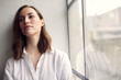 © Martin Villadsen - portrait of thoughtful pretty woman sitting in a window
