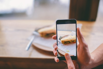 taking photo of sandwich with smart phone