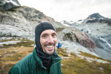 Portrait Of Smiling Man During Hiking Trip