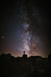 © Cavan Images - Silhouette of adventurous person looking at the milky way