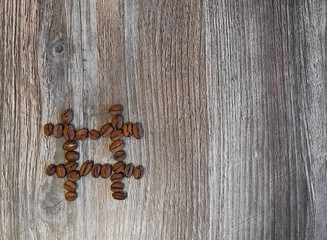 Wall Mural - Hashtag made from coffee beans on a wooden background