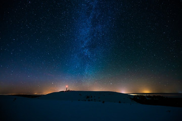 Wall Mural - starry sky in winter, beautiful night sky and snowy mountains