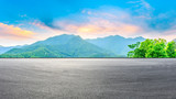 Fototapeta Natura - Race track road and green mountain nature landscape at sunset,panoramic view.