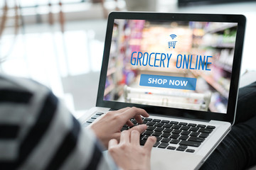 Grocery online shop to order food delivery from supermarket, Woman hands using laptop computer for shopping grocery store online, electronic marketing, e commerce business concept