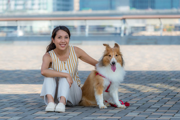 Canvas Print - Woman with her herding dog at outdoor