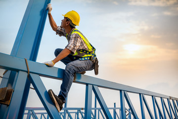 Poster - Engineer working in a metal roof structure,Construction engineer wear safety uniform inspection metal roofing work for industrial.