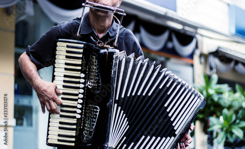 Fotomural close up musician playing accordion show on street