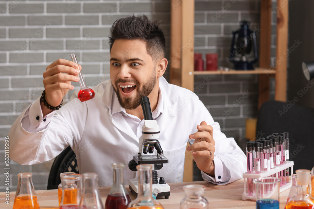 Crazy male alchemist working in laboratory