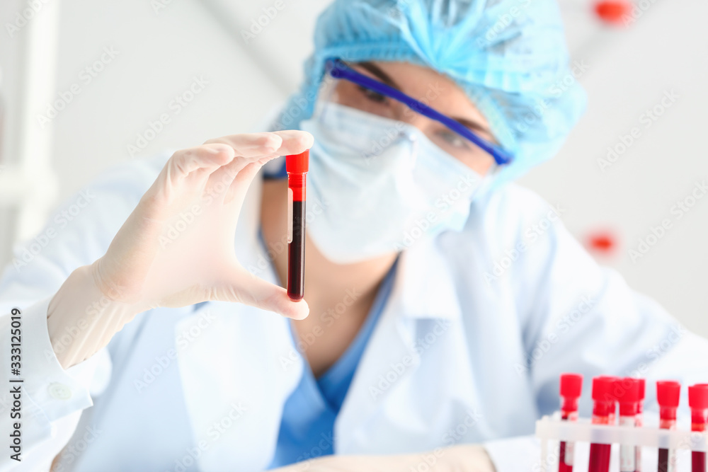 Doctor working with blood samples in laboratory