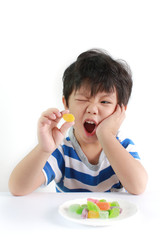 Wall Mural - Little Asian boy with toothache action isolated on white background