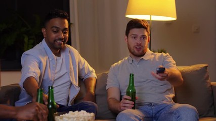 Sticker - friendship, leisure and people concept - happy male friends with beer and popcorn watching tv at home at night