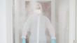 © Video_StockOrg - Person in pandemic clothing decontaminate with spray