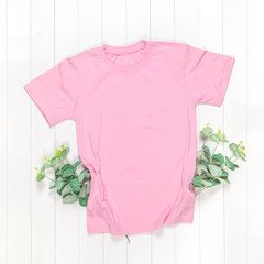 Wall Mural - Pink t-shirt with short sleeves and green branches