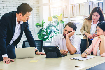 Businessman colleagues getting bored and sleepy in a meeting at office, unhappy business concept	