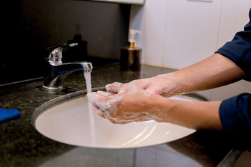 Washing hands rubbing with soap man for covid-19 virus prevention, hygiene to stop spreading covid-19virus.