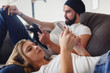 © lordn - Young adult couple using smartphones at home, surfing internet and using social networks. Mobile addiction concept