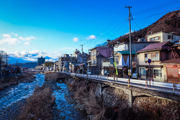 Yudanaka, Japan - January 05, 2020:  View to the mount River in the Small Station City near Nagano