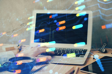 Double exposure of data internet theme hologram with man working on computer on background. Concept of innovation.