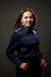 © DSMT - portrait of a beautiful girl in police uniform. Professional posing