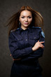 © DSMT - portrait of a beautiful girl in police uniform. Professional posing