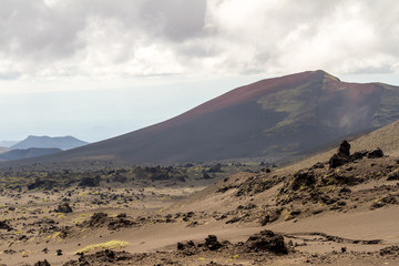 Sticker - Lifeless volcanic landscape in the overcast weather. Kamchatka Peninsula, Russia