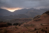 Fototapeta Tęcza - Sunset over Wrynose Pass from Loughrigg, Lake District, UK