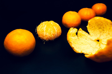 Tangerines on a black background