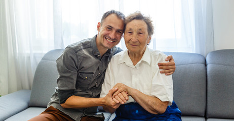 Grandson visiting grandmother at home in quarantine