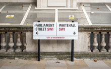 Whitehall, London SW1. A Street Sign Dividing Parliament Street And Whitehall, The London District Central To UK Government Buildings.