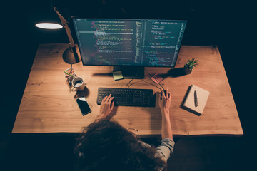 High angle view photo of young dark skin programmer lady look big screen monitor check id-address work overtime wear specs casual denim shirt sit table late night office indoors