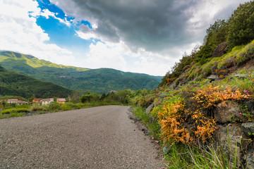 asphalt street on the mountains in a day of spring