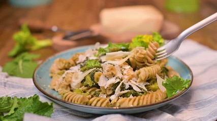 Wall Mural - Fusilini pasta with turnips and parmesan, seasoned with herbs and oil. Traditional Italian Food