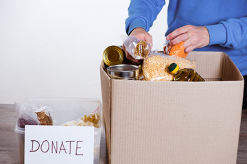 Sticker - Food in donation cardboard box, isolated on white background