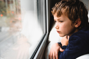 Boy stays home bored by school closings due to covid pandemic.