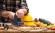 © francescomou - Close-up. Carpenter with the electric sander smoothes a wooden board. Construction industry. Isolated on a white background.