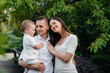 © Andrii - Happy family with their son walking in the Park at sunset. Happiness. Love