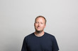 © Fotosushi - Studio portrait of a thoughtful man