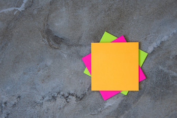 Colorful sticky notes on stone background Image