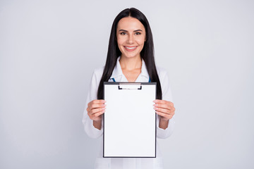 Canvas Print - Photo of beautiful cheerful professional doc lady showing patient contract clinic insurance agreement wear stethoscope white lab coat isolated grey color background