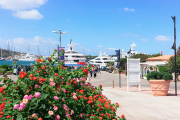 Wall Mural - People at Embankment with yachts of Porto Cervo Sardinia